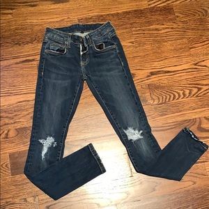 Carmar Jeans with distressed knees. Size 23